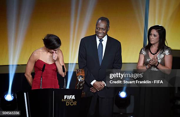 Women's World Player of the Year winner Carli Lloyd of the United States and Houston Dash accepts her award with FIFA Acting President Issa Hayatou...