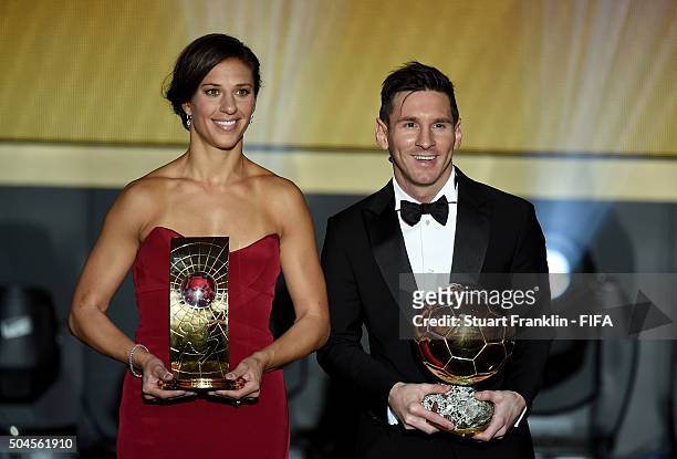 Women's World Player of the Year winner Carli Lloyd of the United States and Houston Dash poses with FIFA Ballon d'Or winner Lionel Messi of...