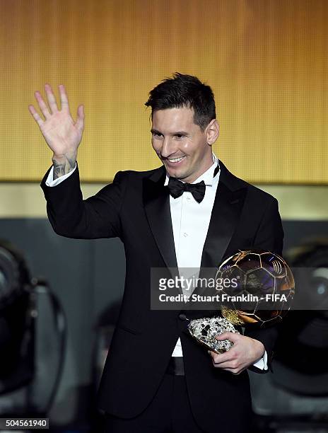 Ballon d'Or winner Lionel Messi of Argentina and Barcelona accepts his award during the FIFA Ballon d'Or Gala 2015 at the Kongresshaus on January 11,...