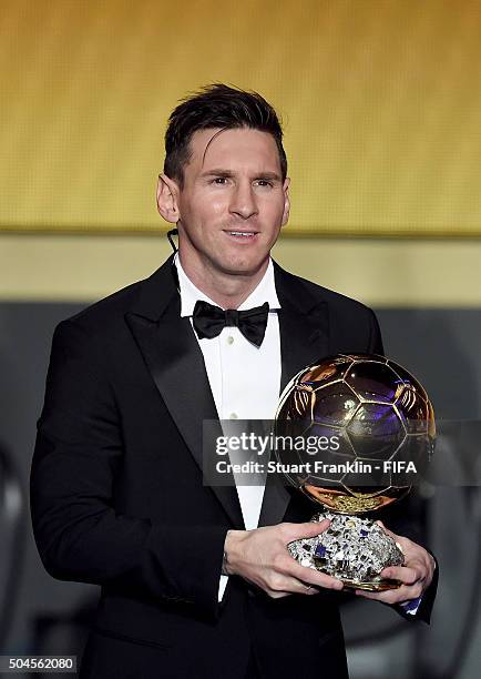 Ballon d'Or winner Lionel Messi of Argentina and Barcelona accepts his award during the FIFA Ballon d'Or Gala 2015 at the Kongresshaus on January 11,...