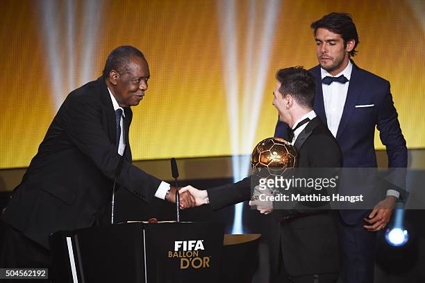 Lionel Messi of Argentina and FC Barcelona receives the Ballon d'or from acting FIFA President Issa Hayatou during the FIFA Ballon d'Or Gala 2015 at...