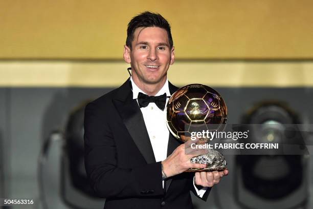 Barcelona and Argentina's forward Lionel Messi poses with trophy after receiving the 2015 FIFA Ballon d'Or award for player of the year during the...