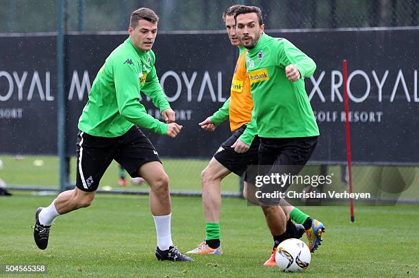 Martin Stranzl is chased by Granit Xhaka during a training session on day 5 of the Borussia Moenchengladbach training camp on January 11, 2016 in...