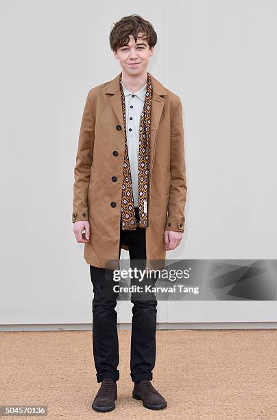 Alex Lawther attends the Burberry show during The London Collections Men AW16 at Kensington Gardens on January 11, 2016 in London, England.