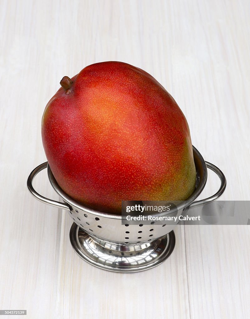 Mango ripe and ready to eat in colander