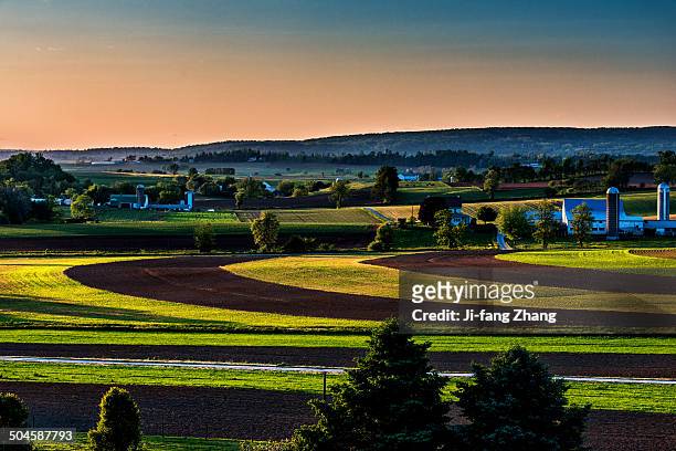 farmland at sunset - lancaster stock-fotos und bilder