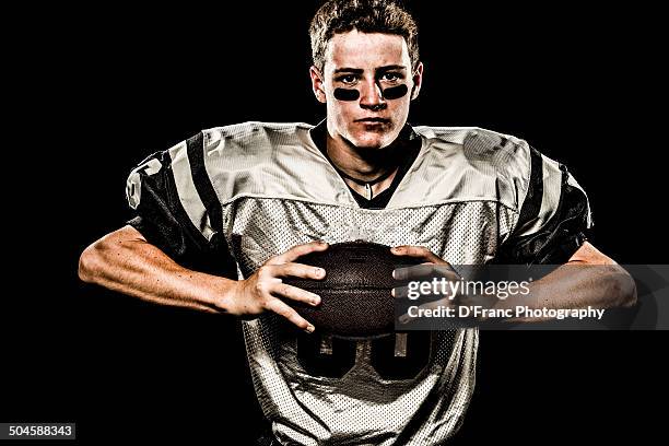 muscular football squeeze - eye black stockfoto's en -beelden