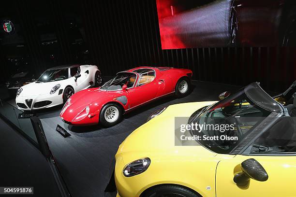 Alfa Romeo displays a 1968 33 Stradale alongside their C4 at the North American International Auto Show on January 11, 2016 in Detroit, Michigan. The...