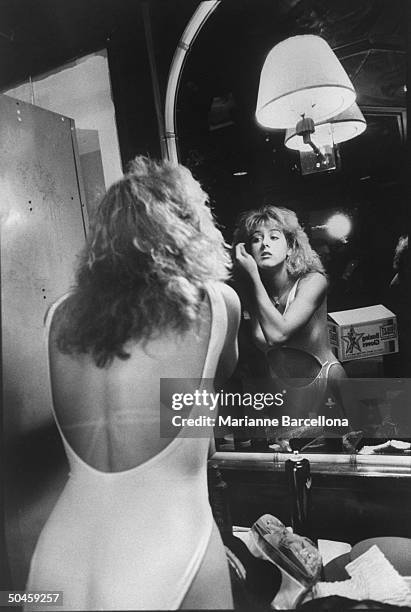 Sasha Allen, one of Billy Dean's Foxy boxers, seen applying pre-fight mascara at Great American Clubhouse.