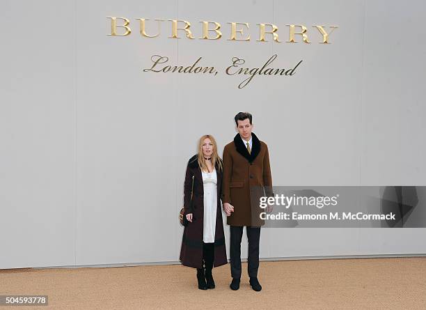 Josephine de La Baume and Mark Ronson attend the Burberry show during The London Collections Men AW16 at Kensington Gardens on January 11, 2016 in...