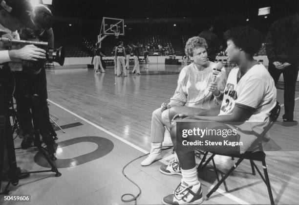 Basketball player-turned-broadcaster Ann Meyers Drysdale interviews college basketball player Donna Clark before University of Illinois-Eastern...