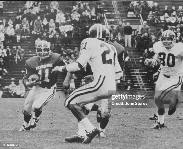 Star flanker at Michigan State Univ. Carrying ball amid opponents on field during game, years before Charlie Wedemeyer contracted Lou Gehrig's...