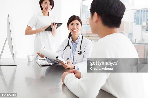 doctors and nurses for medical examination with a smile - japan and medical and hospital stock pictures, royalty-free photos & images