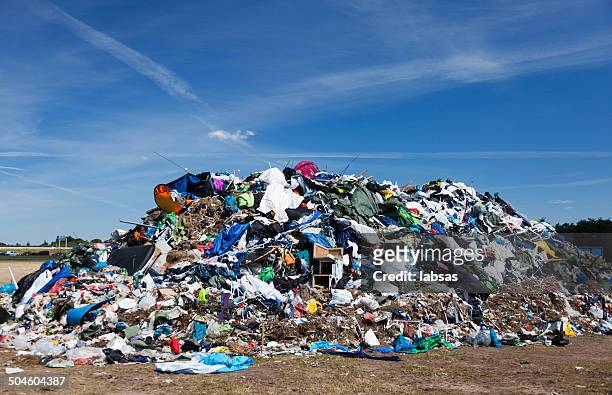 mountain of garbage after music festival. - roskildefjorden stockfoto's en -beelden