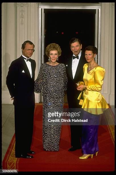 Pres. & Nancy Reagan w. King Carl XVI Gustaf & Queen Silvia of Sweden, w. Nancy wearing a Galanos gown estimated at $17 at WH for state dinner.