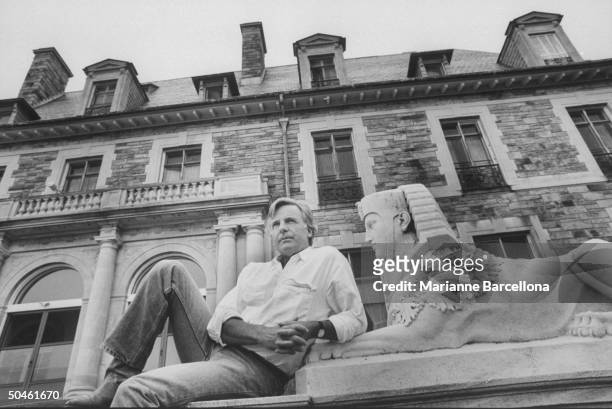 Nelson W. Aldrich Jr, born into upper crust family which lost its money; reclining on steps of family mansion, now owned by Catholic Archdiocese of...