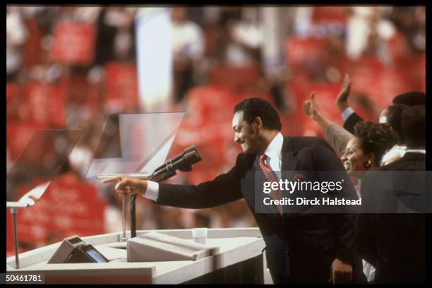 Cand. Jesse Jackson addressing Dem. Natl. Convention, w. Wife Jackie at his side.