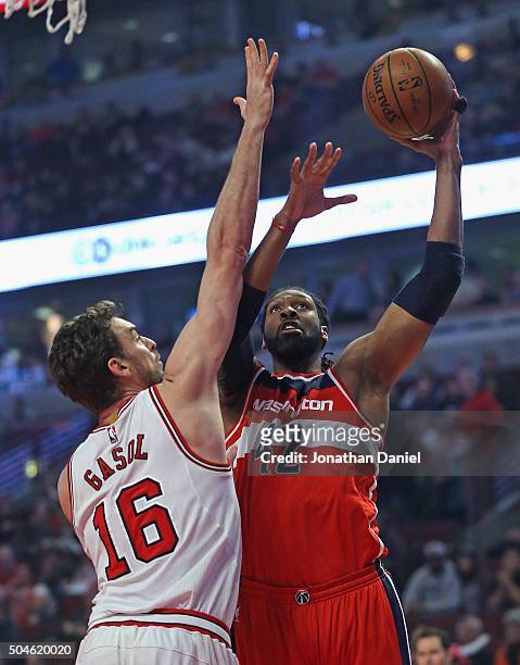 Nene Hilario of the Washington Wizards puts up a shot against Pau Gasol of the Chicago Bulls at the United Center on January 11, 2016 in Chicago,...