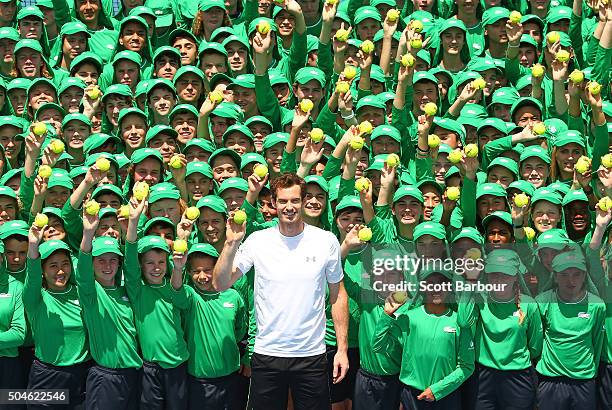 Andy Murray of Great Britain and ballkids from Australia and overseas pose with tennis balls during the annual ballkid team photo ahead of the 2016...