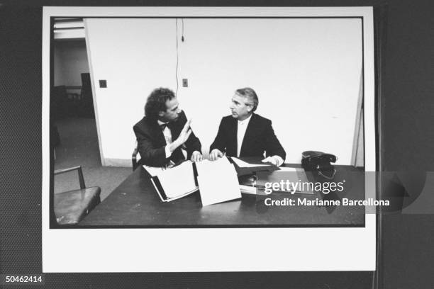 Defense attorney for Joel Steinberg Ira London conferring w. Co-counsel, Adrian DiLucio, in lounge on 16th floor of Manhattan Criminal Courts...