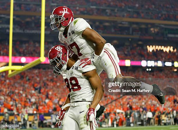 Howard of the Alabama Crimson Tide celebrates with his teammate Kenyan Drake after scoring a 51 yard touchdown in the fourth quarter against the...