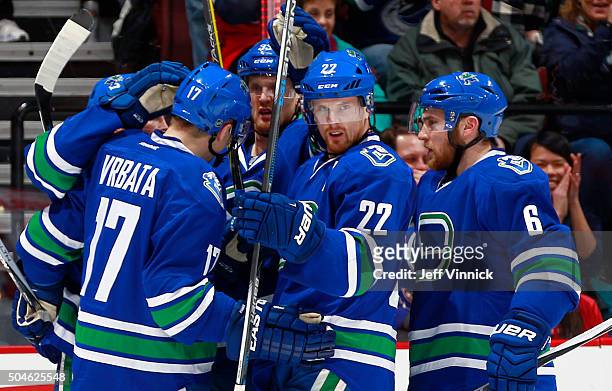 Daniel Sedin of the Vancouver Canucks is congratulated after scoring against the Florida Panthers during their NHL game at Rogers Arena January 11,...