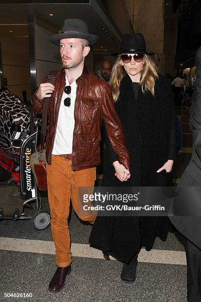 Natalie Dormer and Anthony Byrne are seen at LAX on January 11, 2016 in Los Angeles, California.
