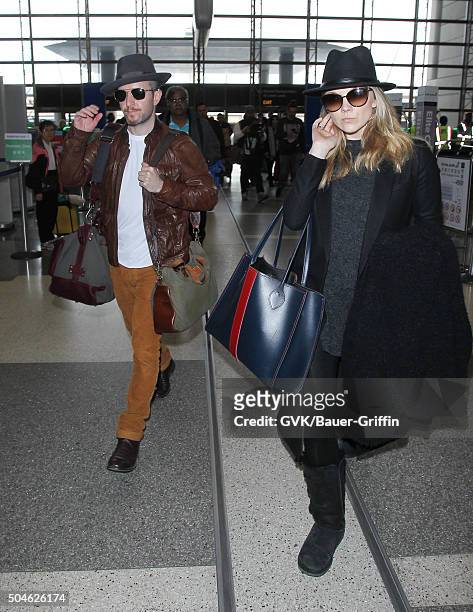 Natalie Dormer and Anthony Byrne are seen at LAX on January 11, 2016 in Los Angeles, California.