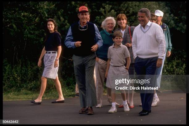 Pres. & Barbara Bush walking w. Canadian PM Brian & Mila Mulroney & their kids, fr. L: Benedict, Mark & Caroline.
