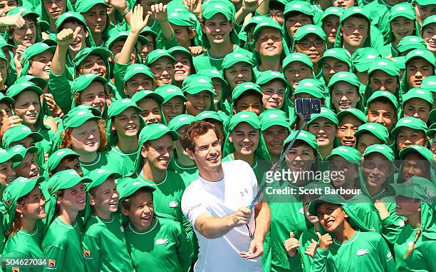 Andy Murray of Great Britain takes a selfie with ballkids from Australia and overseas during the annual ballkid team photo ahead of the 2016...