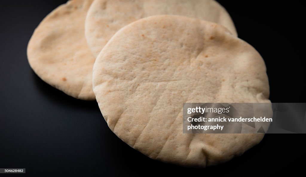 Three Pita against black coloured background