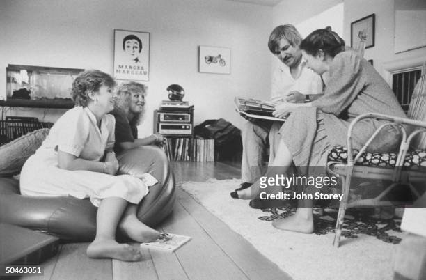 Daughters of Thomas Sutherland, kidnapped by Islamic Jihad in 1985 seen together at home Ann, Kit, Ann's husband Ray Keller and Joan looking over...