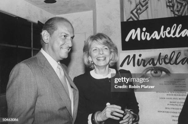 Magazine editor Grace Mirabella standing next to fashion designer Oscar de la Renta at a launch party for her new magazine MIRABELLA at Huberts...