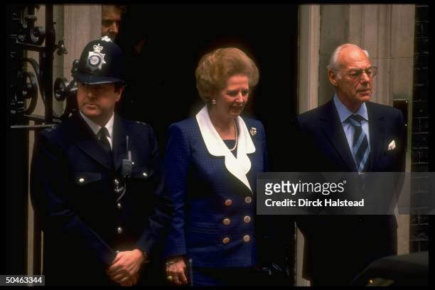 Margaret & Denis Thatcher outside 10 Downing St, w. Guard, during Bush visit.