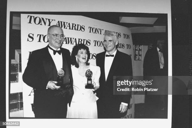 Actor Philip Bosco , actress Pauline Collins , and comedian Steve Martin standing in front of a Tony Awards sign at the 43rd annual awards ceremony.