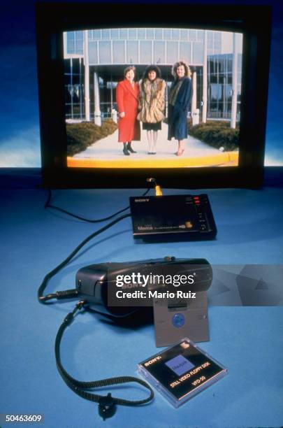 Sony's Mavica still-video camera with its accessories incl. A reusable floppy disk and monitor screen.