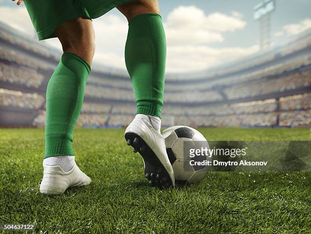 close up soccer player with ball - kicking soccer stock pictures, royalty-free photos & images