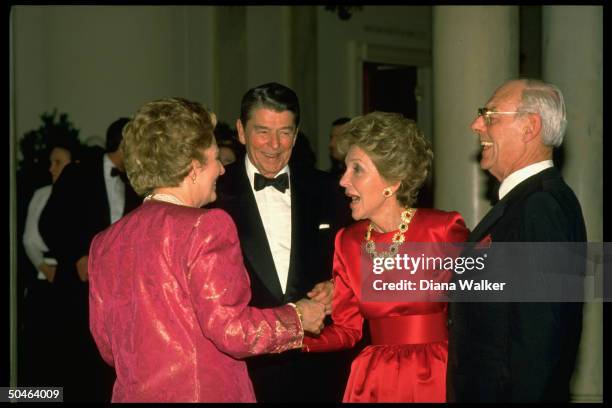 Pres. & Nancy Reagan socializing w. British PM Margaret & Denis Thatcher during State Dinner.