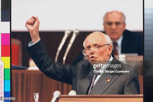 Human rights activist Andrei Sakharov speaking during session of Congress of People's Deputies, w. Soviet Pres. Gorbachev listening in bkgrd.