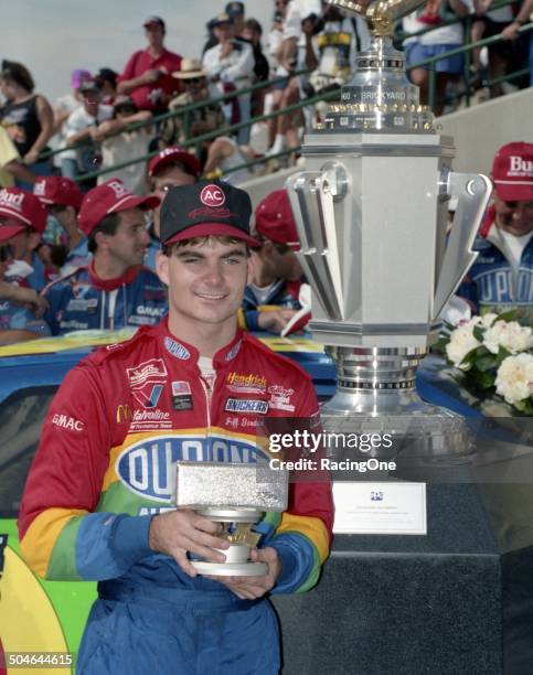 Jeff Gordon with his trophies after winning the inaugural Brickyard 400 NASCAR Cup race on August 6, 1994 at the Indianapolis Motor Speedway in...