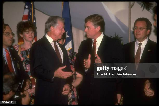 Dan Quayle chatting up former Pres. Jimmy Carter , attending inauguration of Pres. Carlos Andres Perez.