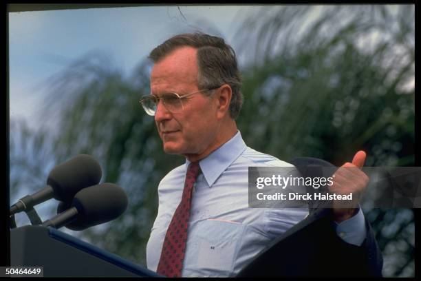 Pres. Bush removing his jacket, not skipping beat, addressing GOP campaign fundraiser for Gov. Bob Martinez in sunny warmth of St. Petersburg, FL.