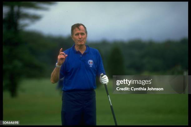 Pres. Bush, determinedly enjoying his vacation despite gulf crisis, pausing to speak while out on golf course in Kennebunkport, ME.