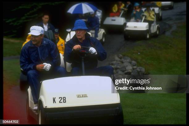 Pres. Bush, determinedly enjoying his vacation despite gulf crisis, at wheel of Yamaha golf cart, out on course in Kennebunkport, ME.