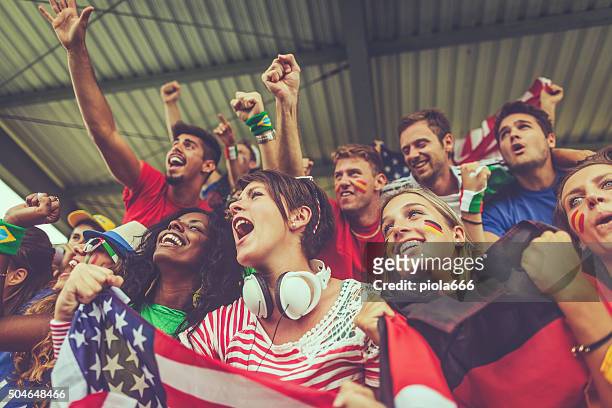 group of multiracial nations supporters together - voetbalcompetitie sportevenement stockfoto's en -beelden