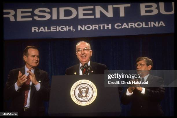Sen. Jesse Helms speaking at GOP fundraiser for his re-election campaign, flanked by tepidly applauding Pres. Bush & Gov. Jim Martin.