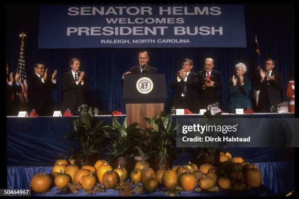 Pres. Bush addressing cam- paign fundraiser for Sen. Jesse Helms , w. Gov. Jim Martin et al on hand.