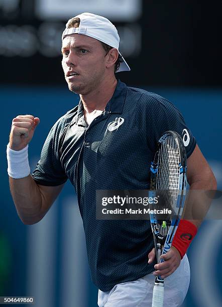 James Duckworth of Australia celebrates winning match point in his match against Inigo Cervantes of Spain during day three of the 2016 Sydney...