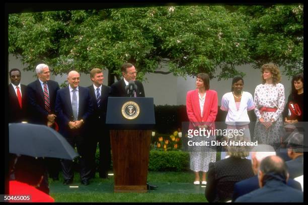 President George HW Bush & VP Dan Quayle flanked by invitees including Jerry Tarkantan during NAACP champs reception in WH Rose Garden.