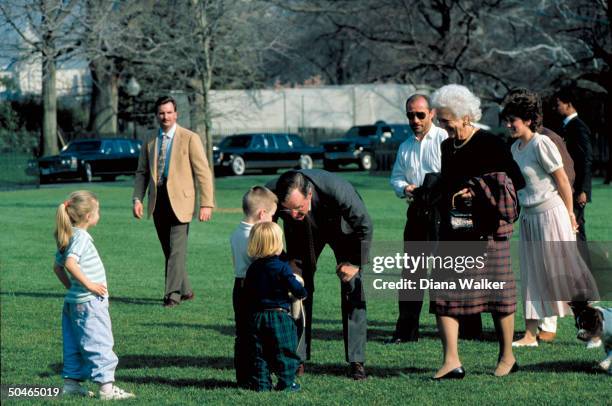 Pres. & Barbara Bush on WH lawn w. Daughter-in-law Laura & grandkids incl. Sam & Lauren & 1st dog, during WH Easter fete.